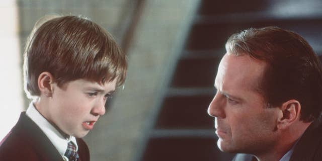 Bruce Willis and Haley Joel Osment in ‘The Sixth Sense.’