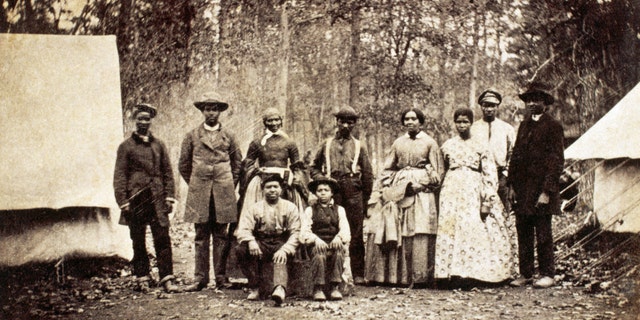 Group of freed slaves who worked as laborers and servants with the 13th Massachusetts Infantry Regiment during the American Civil War, 1862. 