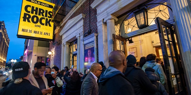 People enter the Wilbur Theatre for a sold out performance by US comedian Chris Rock in Boston, Massachusetts on March 30, 2022. (Photo by JOSEPH PREZIOSO/AFP via Getty Images)