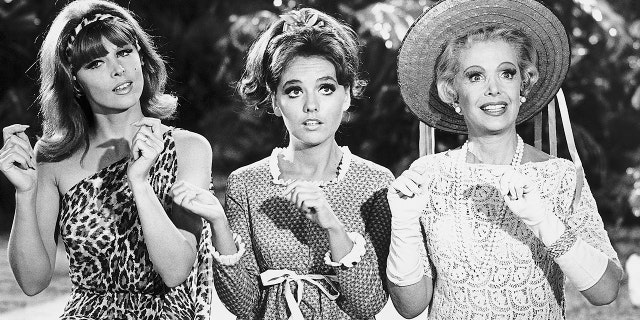 From left to right, sex-kitten Ginger (Tina Louise), girl-next-door Mary Ann (Dawn Wells), and millionairess Mrs. Howell (Natalie Schaefer) in a scene from the 1960s television comedy "Gilligan's Island."