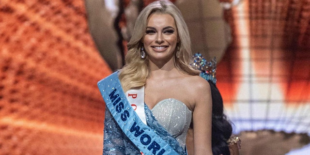 Miss Poland Karolina Bielawska (C) smiles after winning the 70th Miss World beauty pageant at the Coca-Cola Music Hall in San Juan, Puerto Rico on March 16, 2022.