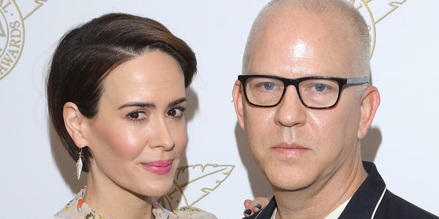 Actress Sarah Paulson (L) and Television Showman of the Year honoree Ryan Murphy pose backstage at the 54th Annual ICG Publicists Awards at The Beverly Hilton Hotel on Feb. 24, 2017, in Beverly Hills, California.