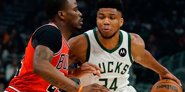 Milwaukee Bucks' Giannis Antetokounmpo drives past Chicago Bulls' Javonte Green during the first half of an NBA basketball game Tuesday, March 22, 2022, in Milwaukee.