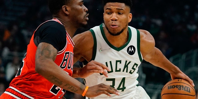 Milwaukee Bucks' Giannis Antetokounmpo drives past Chicago Bulls' Javonte Green during the first half of an NBA basketball game Tuesday, March 22, 2022, in Milwaukee.
