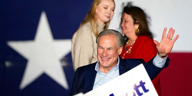 Texas Gov. Greg Abbott, with his wife Cecilia, right, and daughter Audrey, left, arrives for a primary election night event, Tuesday, March 1, 2022, in Corpus Christi, Texas. (AP Photo/Eric Gay)