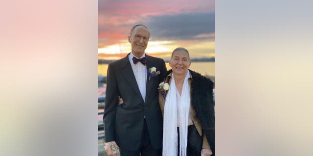 Michael and Colleen Gilbert of Bellevue, Washington, are the parents of six adult children. The pair stopped to take a sunset portrait at Carillion Point after the wedding dress parties.