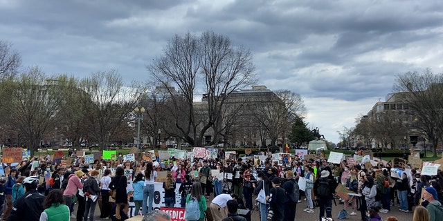 Climate activists gathered outside the White House Friday afternoon