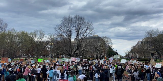 Climate activists gathered outside the White House Friday afternoon