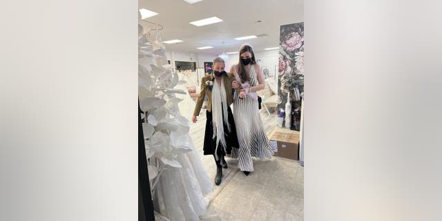 Christine Gilbert (right) surprised her mother, Colleen Gilbert (left), with a trip to a bridal salon so that she could see her daughter try on wedding dresses — even though the daughter is not yet getting married.