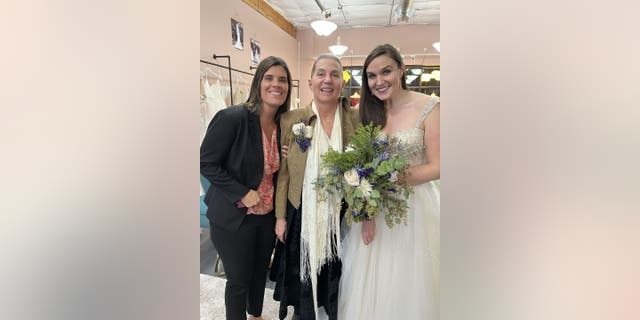 Krista Larrison (left) met Colleen Gilbert (middle) and Christine Gilbert (right) in person when the pair stopped by Kita Events Northwest Bridal &amp; Formal Wear for a wedding dress try-on party.