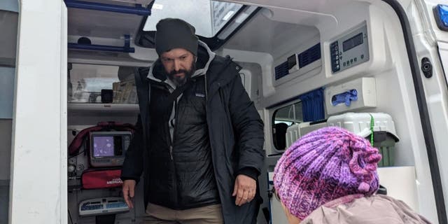 Two Project DYNAMO volunteers prep the ambulance that transported three premature babies from Ukraine to Poland. The special rescue mission was codenamed 'GEMINI.'