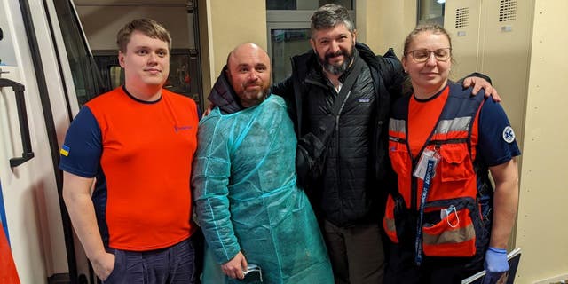 Medical staff and volunteers in Ukraine who worked on Project DYNAMO's rescue mission 'GEMINI' pose for a picture.