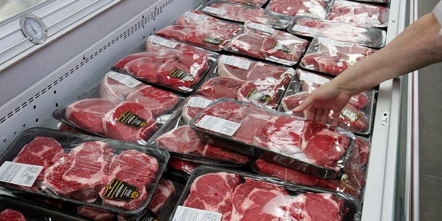 Meat prices have skyrocketed, but profits are also high for a small number of meat producers. Pictured: A customer shops for meat at a Sam's Club store, a division of Wal-Mart Stores in Bentonville, Arkansas. REUTERS/Jessica Rinaldi