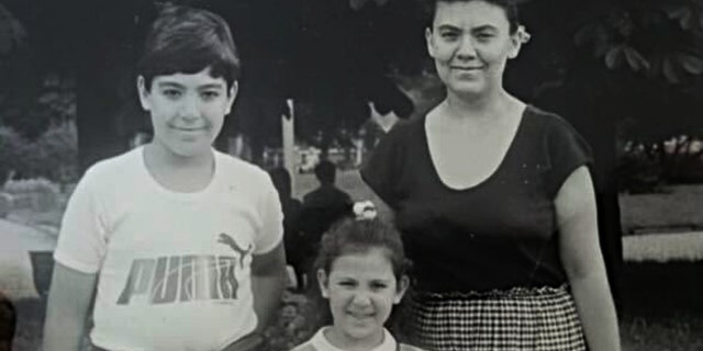 Stella Binkenvich (center), her brother (left) and her mother (right) in Donetsk.