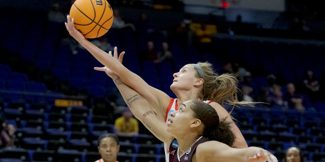 Ohio State guard Jacy Sheldon (4) fouls Missouri State guard Mariah White (14) while going for a rebound in the first half of a women's college basketball game in the first round of the NCAA tournament, Saturday, March 19, 2022, in Baton Rouge, La.