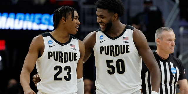 Purdue's Jaden Ivey and Trevion Williams celebrate during the second half of a second-round NCAA college basketball tournament game against Texas Sunday, March 20, 2022, in Milwaukee. Purdue won 81-71.