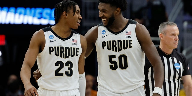 Purdue's Jaden Ivey and Trevion Williams celebrate during the second half of a second-round NCAA college basketball tournament game against Texas Sunday, March 20, 2022, in Milwaukee. Purdue won 81-71.