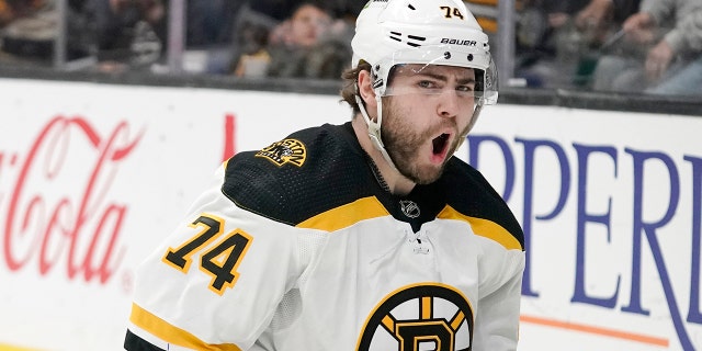 Boston Bruins left wing Jake DeBrusk celebrates his second goal of the game during the first period of an NHL hockey game against the Los Angeles Kings Monday, Feb. 28, 2022, in Los Angeles.