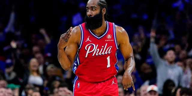 Philadelphia 76ers' James Harden reacts after a basket during the first half of an NBA basketball game against the New York Knicks, Wednesday, March 2, 2022, in Philadelphia.