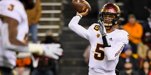 FILE - Arizona State quarterback Jayden Daniels (5) passes to running back Rachaad White (3) during the first quarter of an NCAA college football game Nov. 20, 2021, in Corvallis, Ore. Former Arizona State quarterback Daniels is transferring to LSU, where he will enter a wide open competition to be the starter in coach Brian Kelly’s first season with the Tigers.
