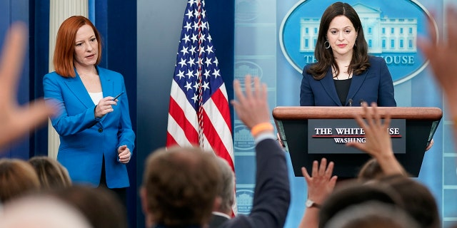 White House press secretary Jen Psaki, left, calls on a reporter as Anne Neuberger, Deputy National Security Advisor for Cyber and Emerging Technology, takes questions during a press briefing at the White House, Monday, March 21, 2022, in Washington.