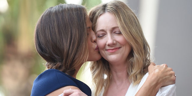 Jennifer Garner, left, kisses fellow actress Judy Greer as Garner receives a star on the Hollywood 0Walk of Fame, Aug.  20, 2018, in Hollywood, California.