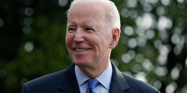 President Biden speaks with members of the press before boarding Marine One on the South Lawn of the White House, Wednesday, March 23, 2022, in Washington. 