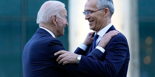 President Biden and NATO Secretary General Jens Stoltenberg speak while visiting a memorial to the September 11 terrorist attacks at NATO headquarters in Brussels, June 14, 2021. 