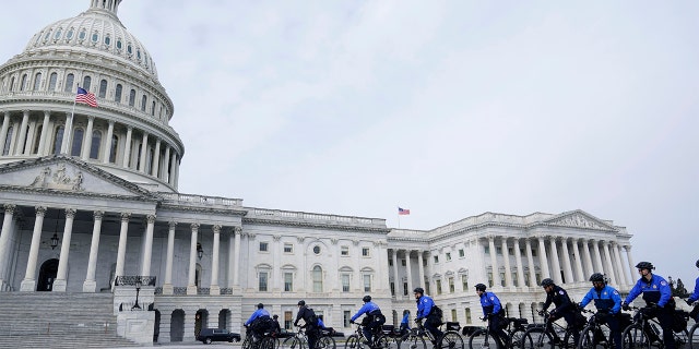 U.S. Capitol Police officers patrol on bikes outside the Capitol, Tuesday, March 1, 2022, in Washington.