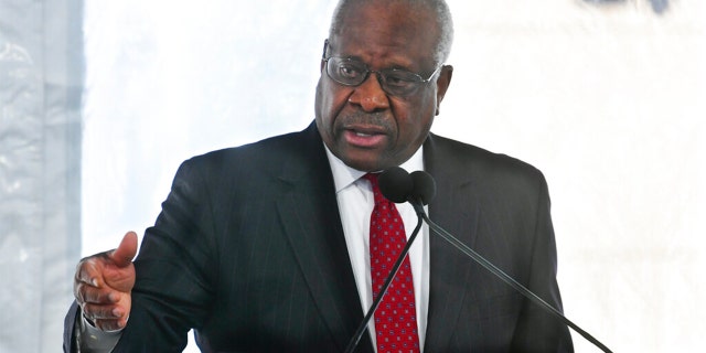 FILE - Supreme Court Justice Clarence Thomas delivers a keynote speech during a dedication of Georgia new Nathan Deal Judicial Center in Atlanta, Feb. 11, 2020.