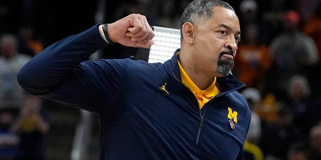 Michigan head coach Juwan Howard reacts after his team defeated Tennessee Saturday, March 19, 2022, in Indianapolis.