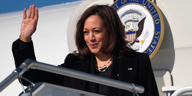 Vice President Kamala Harris waves as she boards Air Force Two prior to departing for Romania, at Warsaw Chopin International Airport in Poland on March 11, 2022.