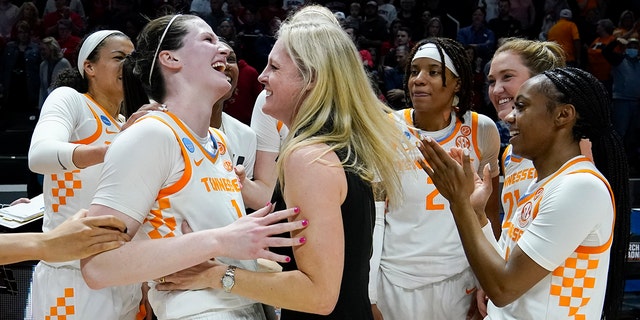Tennessee head coach Kellie Harper celebrates with Sara Puckett (1) after Tennessee beat Belmont in a women's college basketball game in the second round of the NCAA tournament Monday, March 21, 2022, in Knoxville, Tenn.