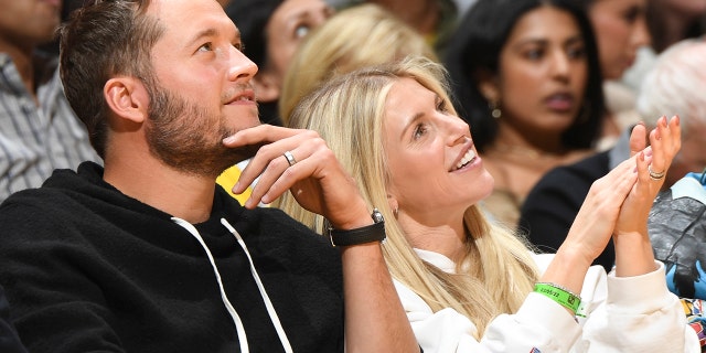 Super Bowl Champion, Matthew Stafford and Kelly Stafford attend a game between the Golden State Warriors and Los Angeles Lakers on March 5, 2022, at Crypto.Com Arena in Los Angeles, California.