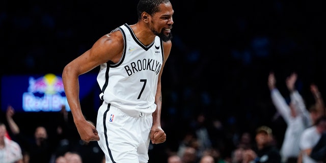 Brooklyn Nets' Kevin Durant (7) celebrates after making a 3-point basket during the second half of an NBA basketball game against the Utah Jazz, Monday, March 21, 2022, in New York.