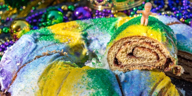 King cake is a Mardi Gras staple. Often times, a plastic baby is placed inside the cake. 