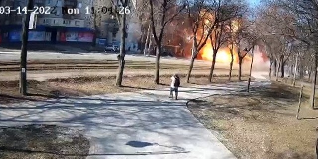 Surveillance video from a park in Kyiv shows the moment a Russian rocket landed on a civilian bus, according to city officials.