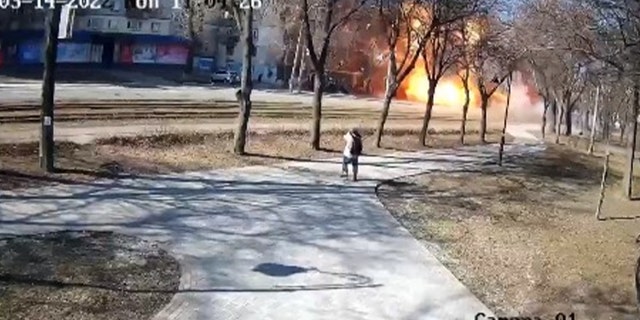 Surveillance video from a park in Kyiv shows the moment a Russian rocket landed on a civilian bus, according to city officials.
