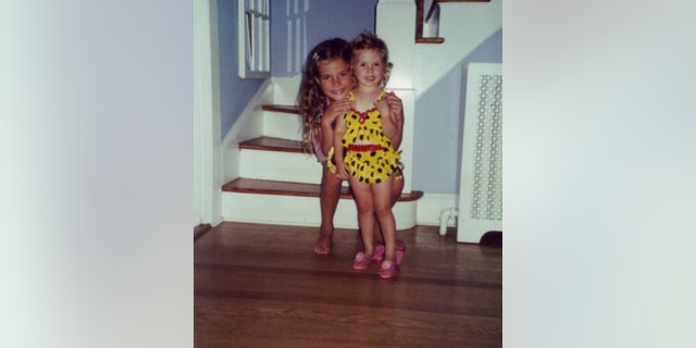 Author Kyleigh Leddy (at right, as a little girl), with her older sister, Kait, who's sitting behind her. Writes the author, "Everything about mental illness was, and largely remains, a hushed whisper. A label that terrifies more than it liberates." Her hope, she told Fox News Digital, is to shine a bright light on it. 