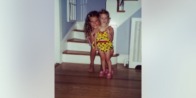 Author Kyleigh Leddy (at right, as a little girl), with her older sister, Kait, who's sitting behind her. Writes the author, "Everything about mental illness was, and largely remains, a hushed whisper. A label that terrifies more than it liberates." Her hope, she told Fox News Digital, is to shine a bright light on it.