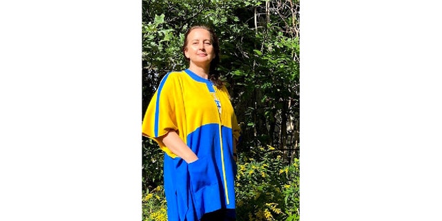 Lana Riggins, a Ukraine-born knitwear designer, is selling blue-and-yellow varsity sweater jackets to benefit a local charity that’s supporting Ukraine.