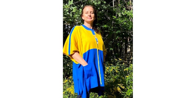 Lana Riggins, a Ukraine-born knitwear designer, is selling blue-and-yellow varsity sweater jackets to benefit a local charity that’s supporting Ukraine.