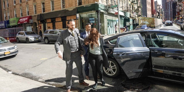 Lauren Pazienza being led into a New York City courthouse on March 22, 2022Â