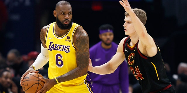 Los Angeles Lakers' LeBron James (6) plays against Cleveland Cavaliers' Lauri Markkanen (24) during the first half of an NBA basketball game, Monday, March 21, 2022, in Cleveland.
