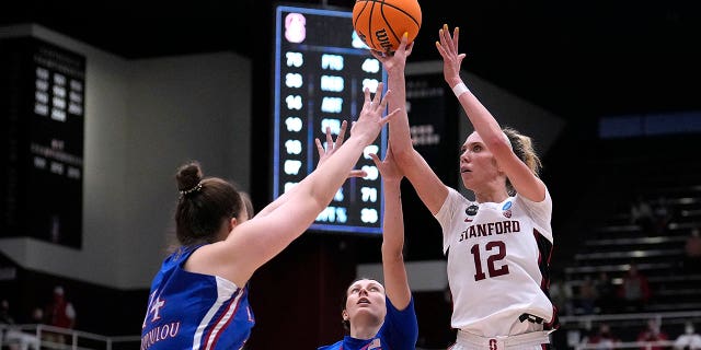 Stanford guard Lexie Hull (12) shoots over Kansas center Danai Papadopoulou (14) and guard Holly Kersgieter (13) during the second half of a second-round game in the NCAA women's college basketball tournament Sunday, March 20, 2022, in Stanford, Calif.
