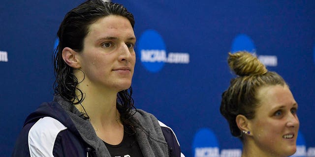 Lia Thomas looks on from the podium after finishing fifth in the 200-yard freestyle during the Swimming & Diving Championships on March 18, 2022, in Atlanta.