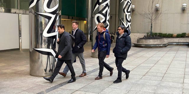 Major League Baseball Deputy Commissioner Dan Halem, 왼쪽, Senior Vice President Patrick Houlihan, 왼쪽에서 두 번째, Executive Vice President Morgan Sword, 오른쪽에서 두 번째, and spokesman Glen Caplin arrive at the Major League Baseball Players Association in New York for labor negotiations, Tuesday March 8, 2022.