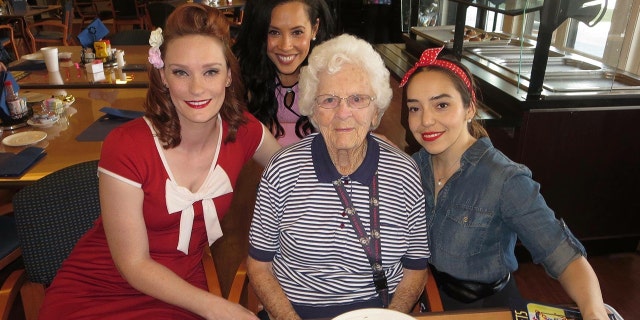 This photo shows Jennifer Marshall (left) volunteering in February 2017 for Pin-Ups for Vets.