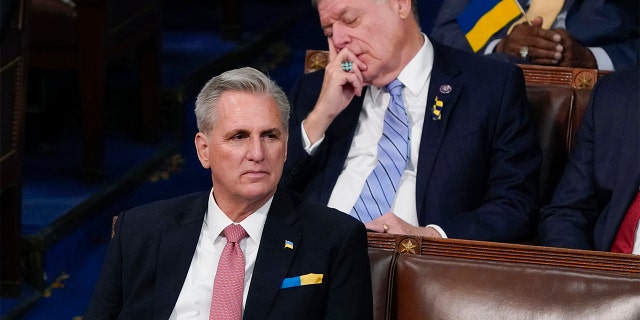 House Minority Leader Kevin McCarthy of Calif., listens as Rep. Tom Cole, R-Okla., closes his eyes as President Joe Biden delivers his first State of the Union address to a joint session of Congress, at the Capitol in Washington, Tuesday, March 1, 2022.