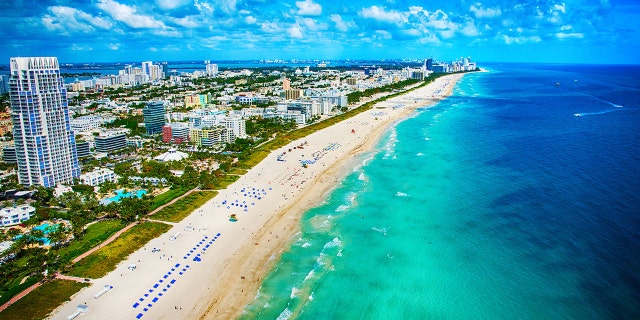 The white sands and turquoise ocean of Miami Beach, Florida as shot from an altitude of about 500 feet during a helicopter photo flight.